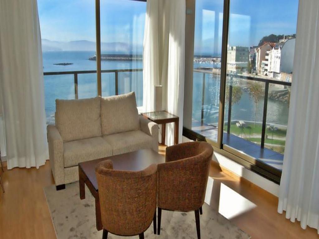 Apartamentos Turisticos Playa De Osmo Corme ภายนอก รูปภาพ