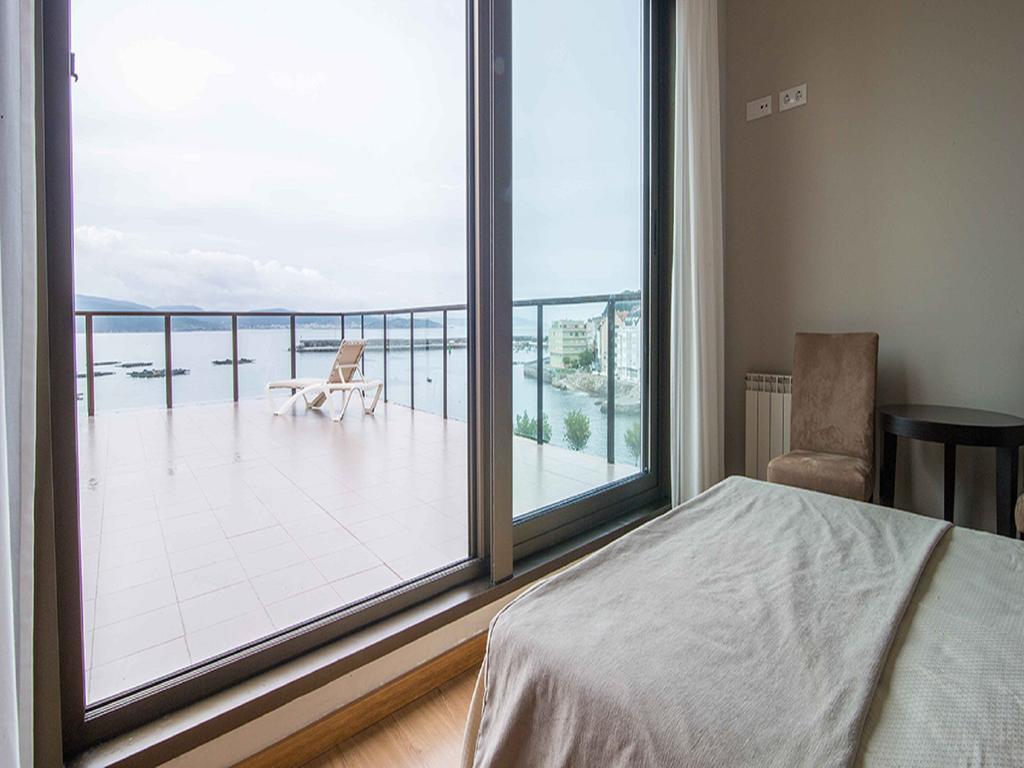 Apartamentos Turisticos Playa De Osmo Corme ภายนอก รูปภาพ