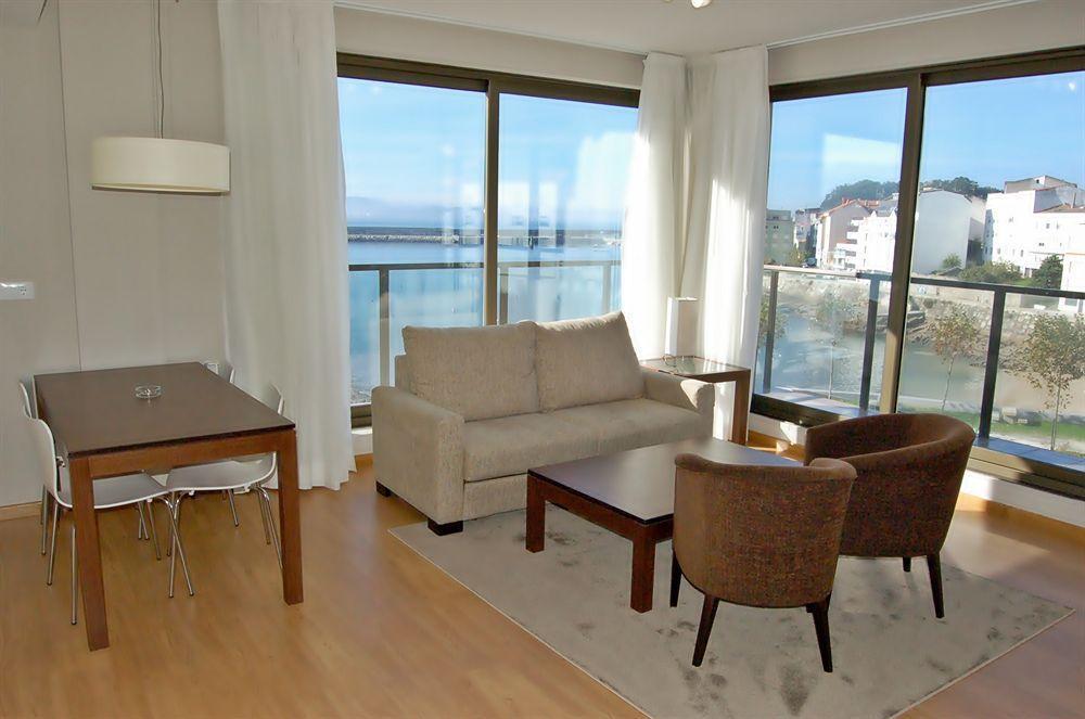Apartamentos Turisticos Playa De Osmo Corme ภายนอก รูปภาพ