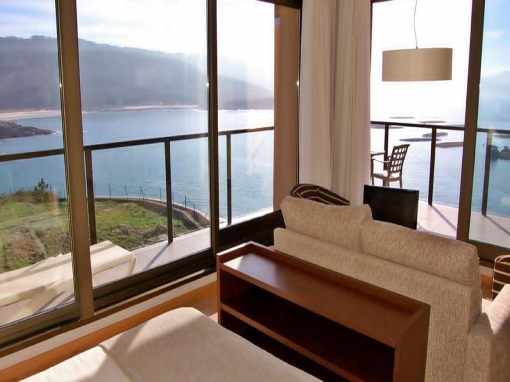 Apartamentos Turisticos Playa De Osmo Corme ภายนอก รูปภาพ